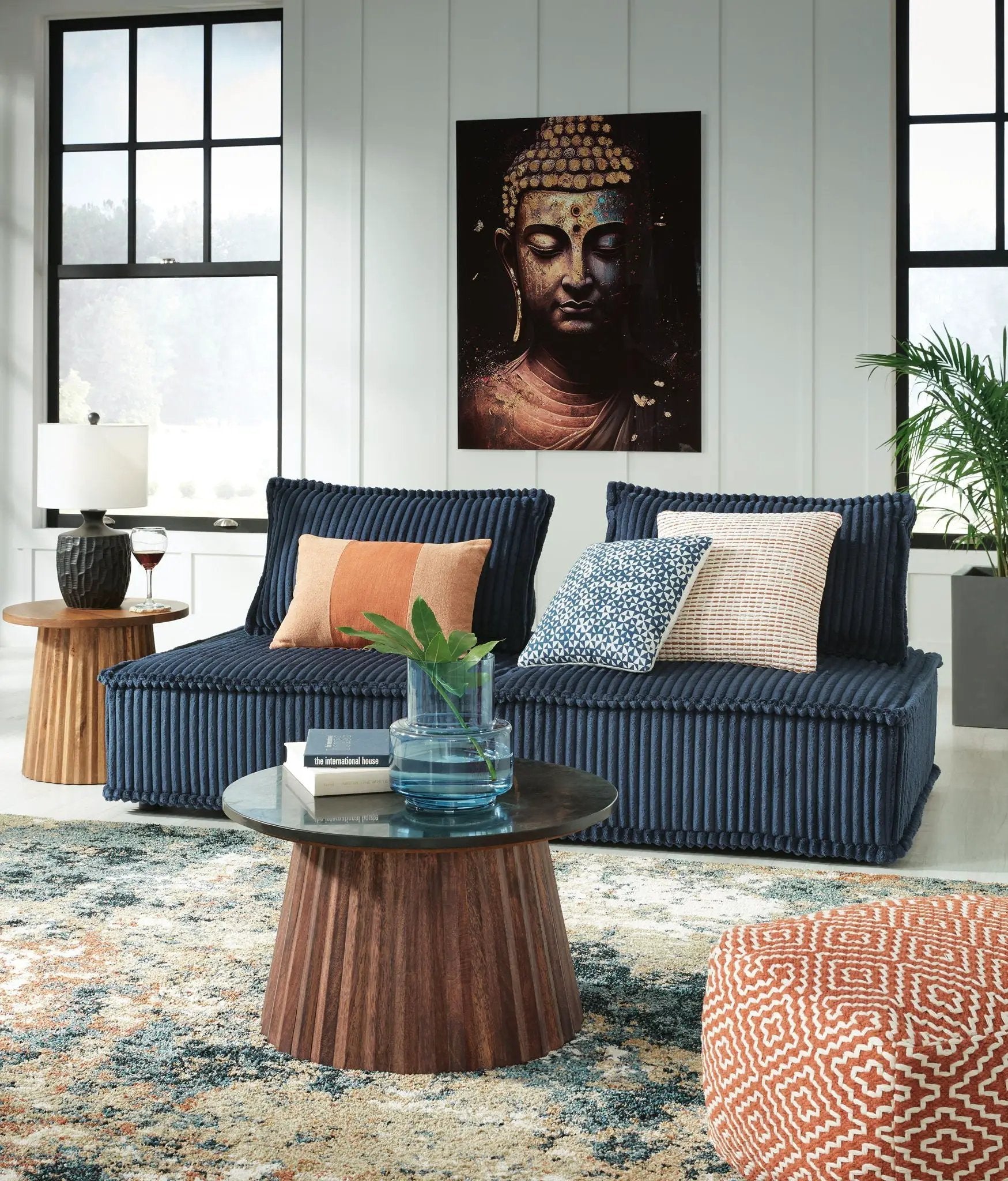 Bales Sectional by Unique Piece Furniture in navy ribbed fabric with orange accent pillow on Tampa Home & Garden Store