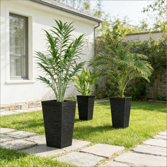 Stackable tapered outdoor planters set of 3 in black textured pots with tall green foliage on Tampa Home & Garden Store