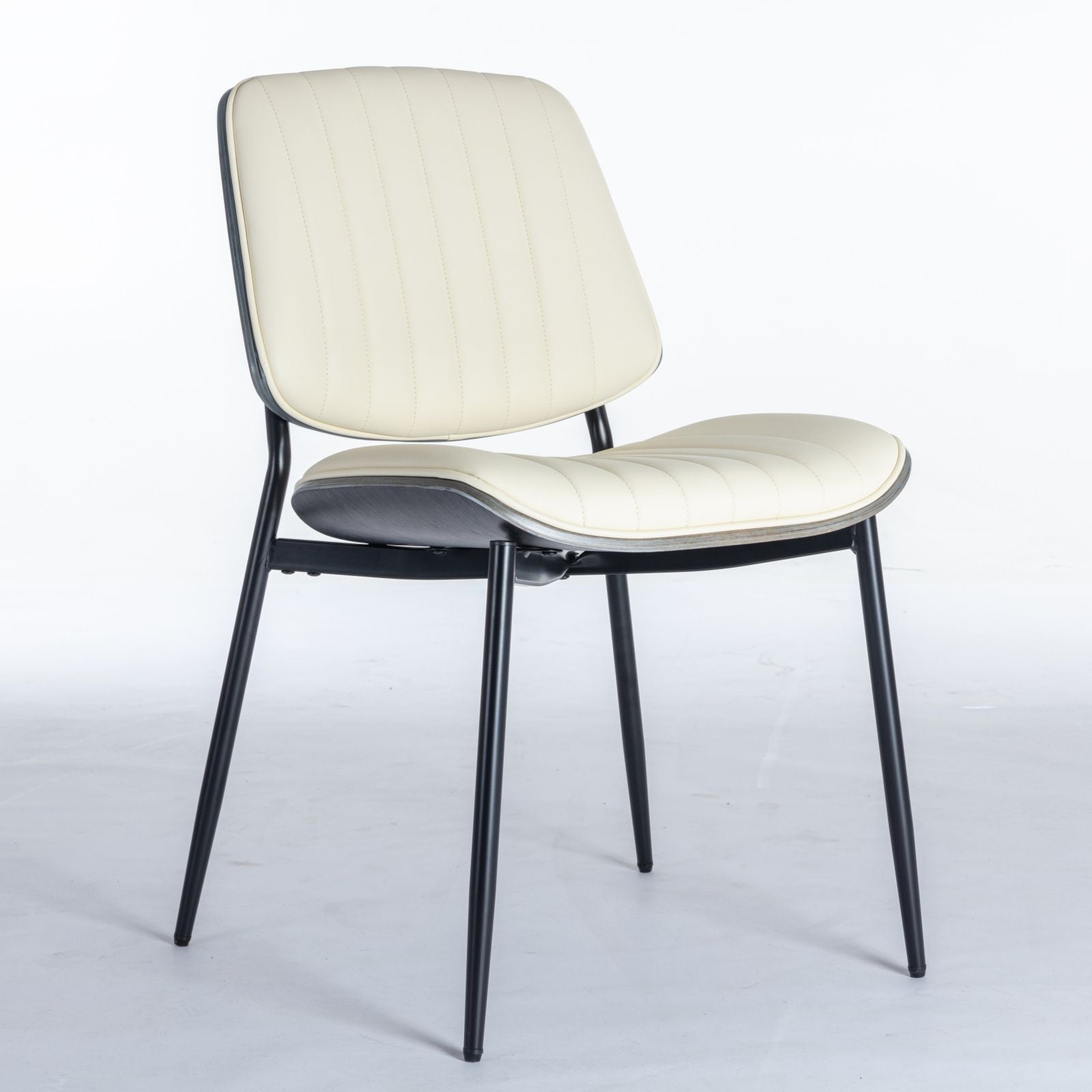 Dining chair cream upholstered seat and back with vertical stitching on black metal legs on Tampa Home & Garden Store