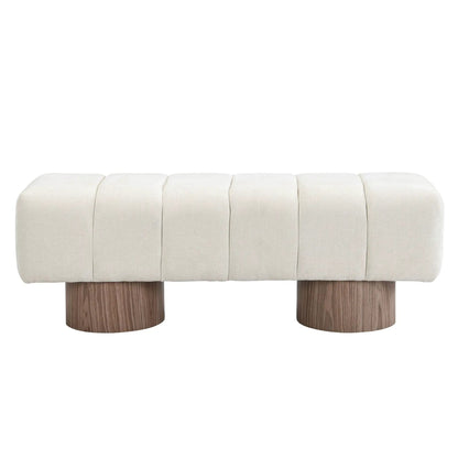 Upholstered dining bench in cream fabric with tufted panels and chunky wooden legs on Tampa Home & Garden Store