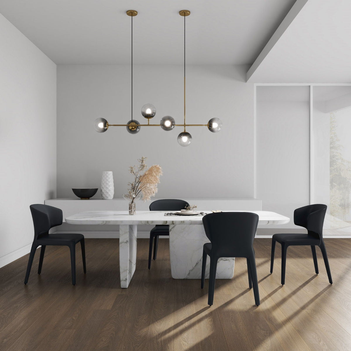 Four Conrad dining chairs with metal frames in black around a white marble dining table on Tampa Home & Garden Store