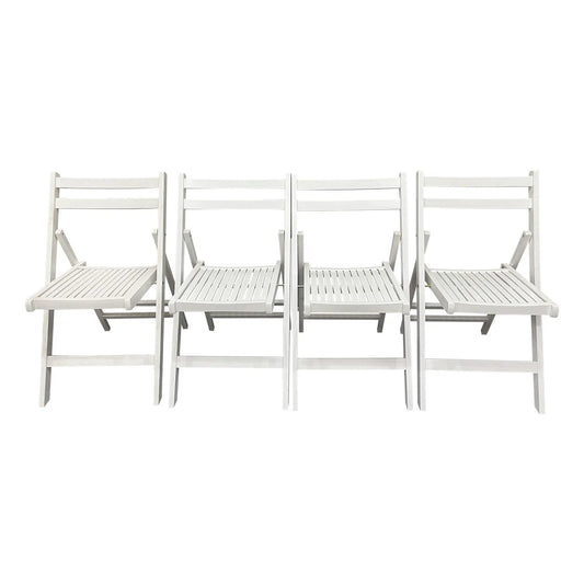 Set of four white folding chairs with slatted seats and backs on Tampa Home & Garden Store