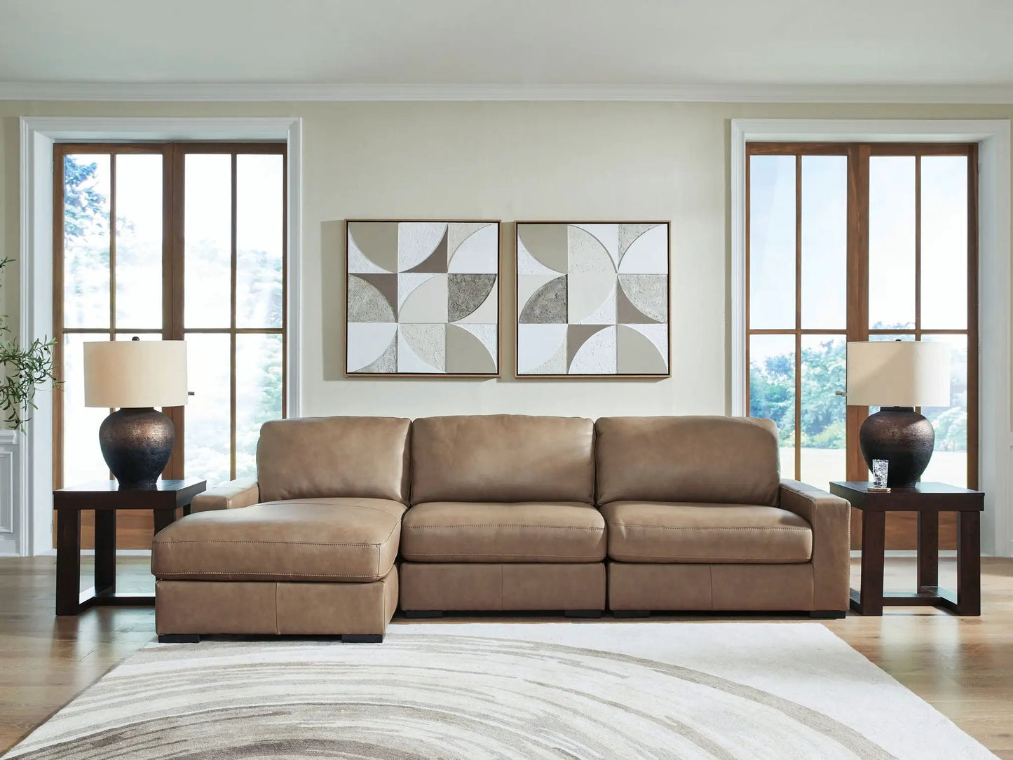 Veronella stationary sectional in tan leather with wood end tables in a cozy living room on Tampa Home & Garden Store