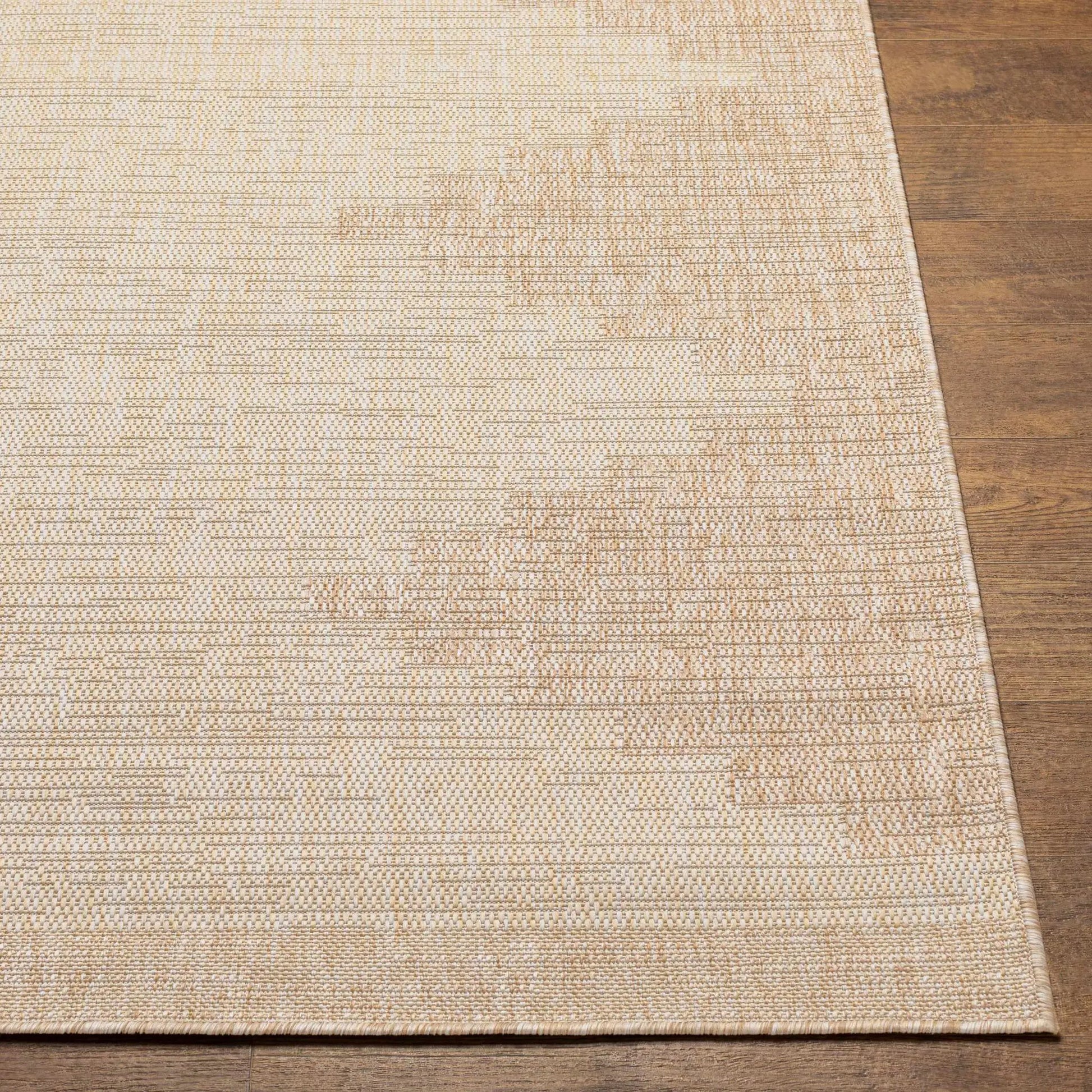 Djugun Beige Indoor & Outdoor Rug by Boutique Rugs with a neutral woven texture on wood floor on Tampa Home & Garden Store
