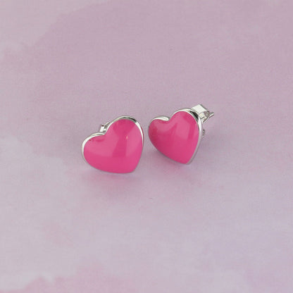 Pair of pink enamel heart stud earrings with silver-tone backs on Tampa Home & Garden Store