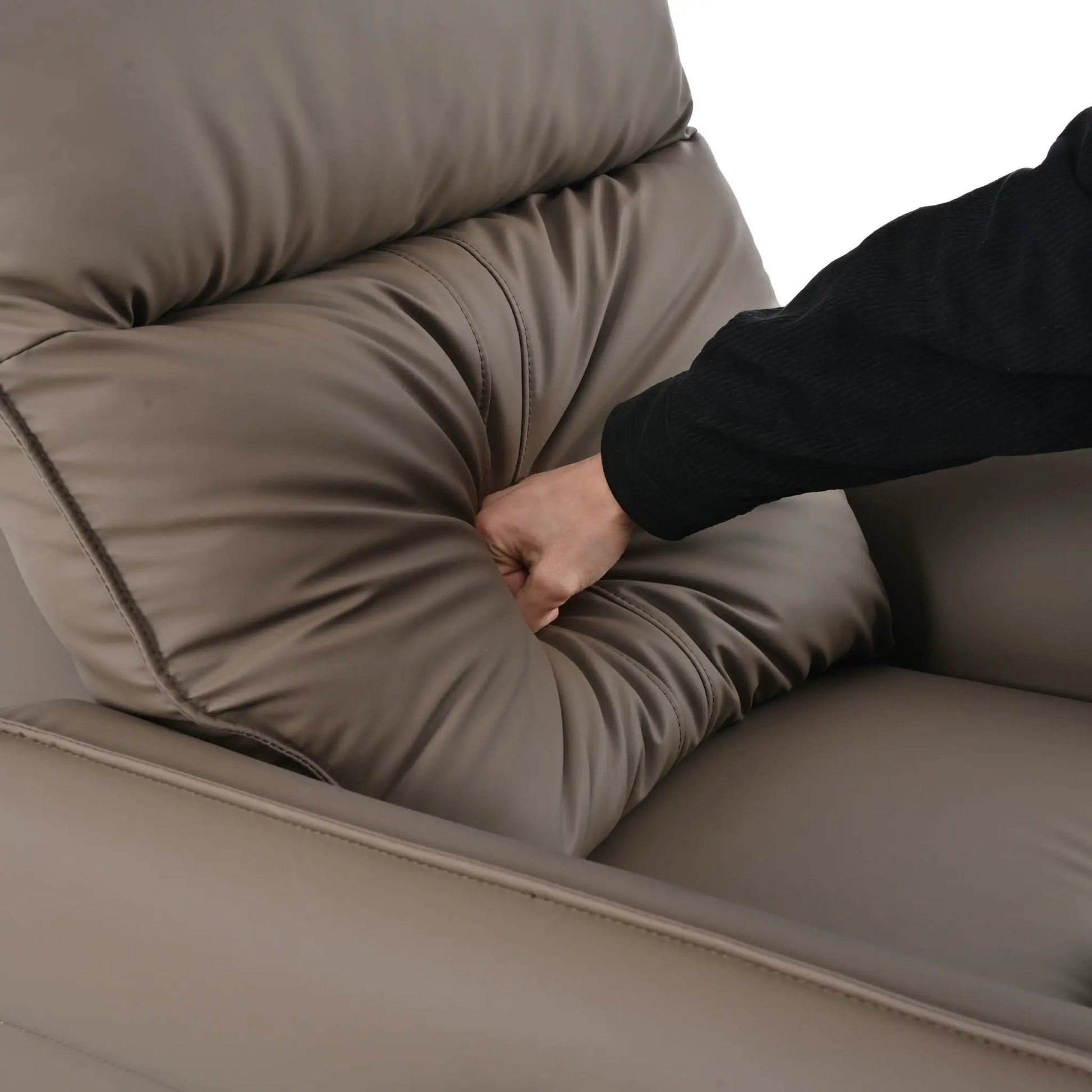 Beige leather swivel rocker recliner chair close-up with visible stitching on Tampa Home & Garden Store