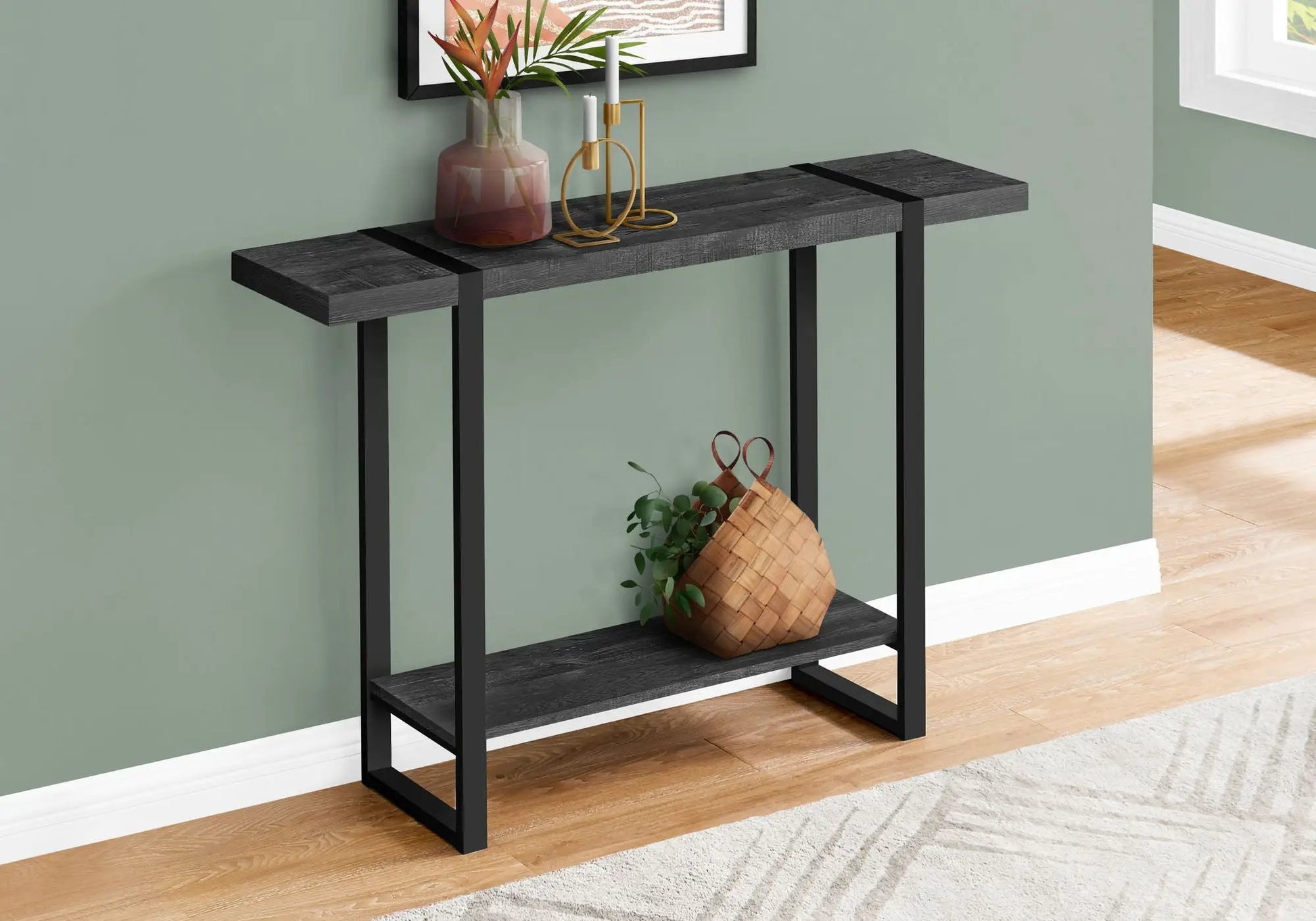 Accent console table for entryway in black metal with dark wood top, vase and candleholders on Tampa Home & Garden Store