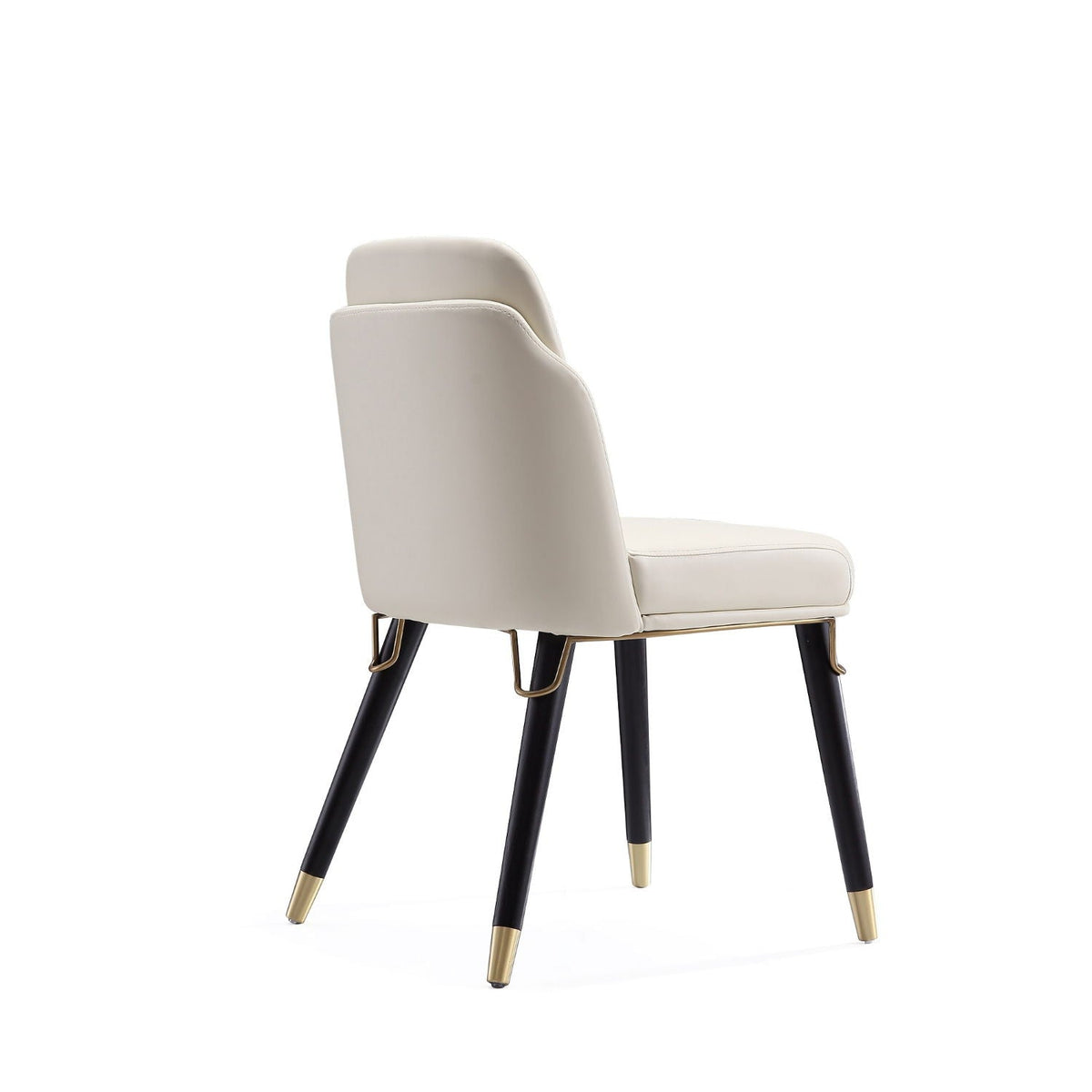 Estelle dining chair beige upholstery with black legs and gold-tone metal caps on Tampa Home & Garden Store