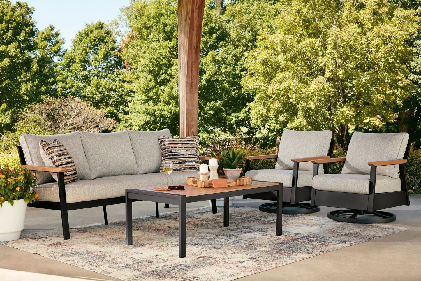 Carmel Highlands 4-piece outdoor sofa set (sofa, two chairs, table) with beige cushions and dark brown frames on Tampa Home & Garden Store