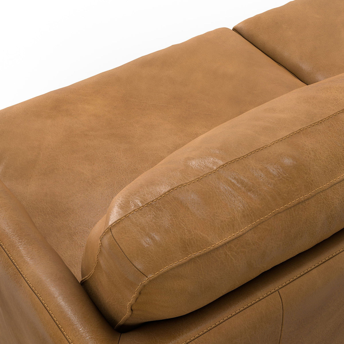 Livingston upholstered sofa close-up in tan leather with visible topstitching on Tampa Home & Garden Store