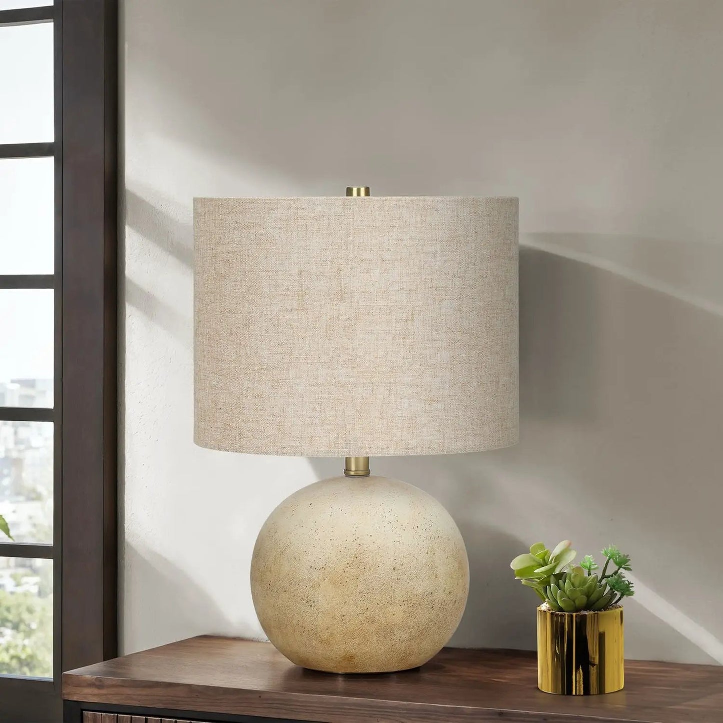 Table lamp lighting by Unique Piece Furniture with beige linen shade and speckled ceramic base on wood surface on Tampa Home & Garden Store