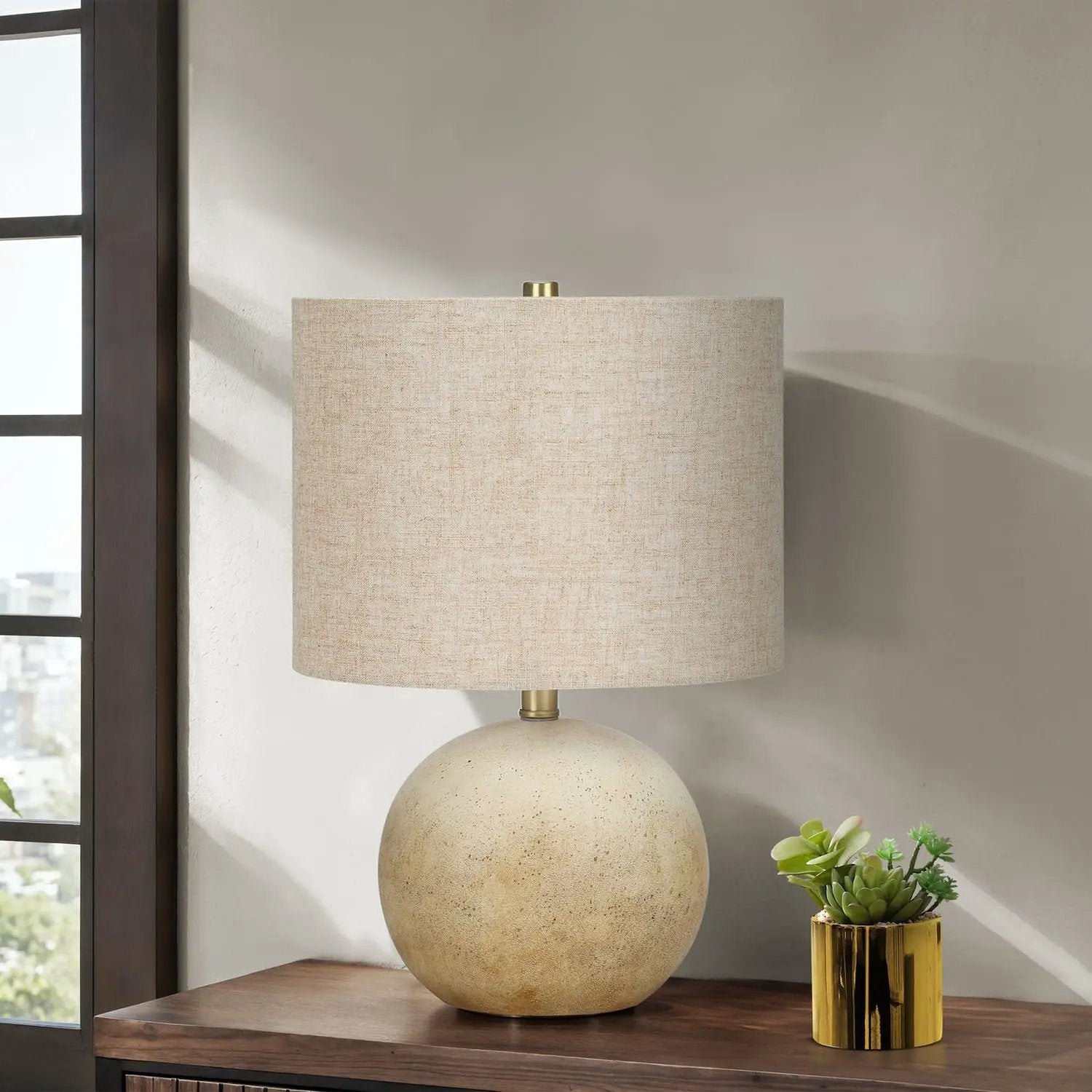 Table lamp lighting by Unique Piece Furniture with beige linen shade and speckled ceramic base on wood surface on Tampa Home & Garden Store