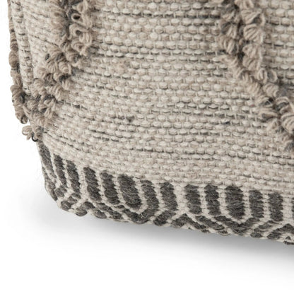 Sweeney Upholstered Square Pouf beige woven boucle fabric close-up with fringe trim on Tampa Home & Garden Store