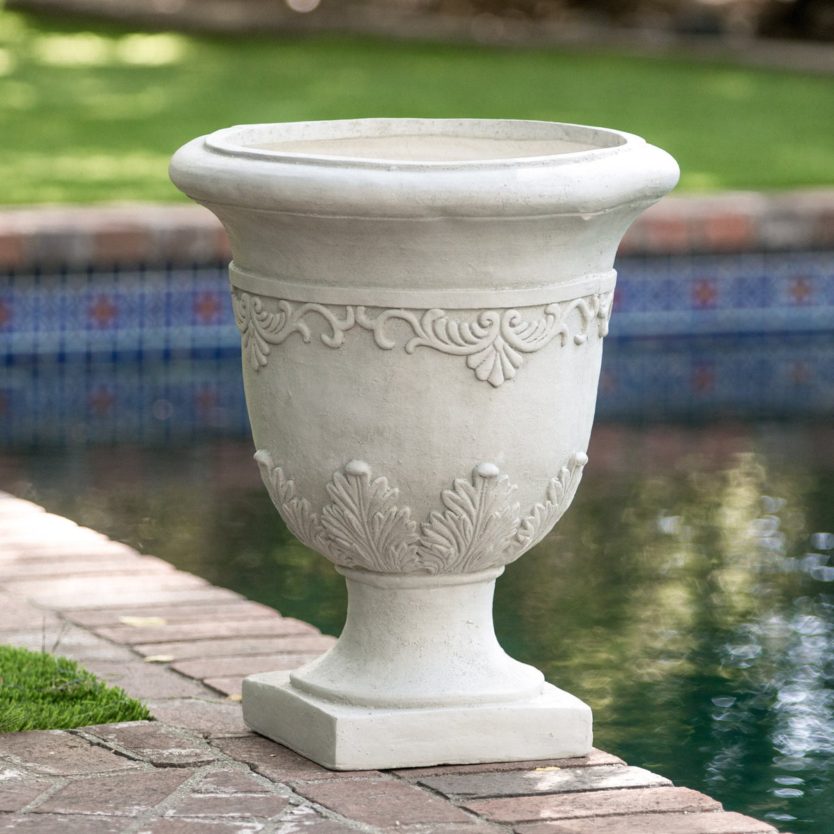 Moroccan urn planter in stone-gray with ornate leaf relief pattern on Tampa Home & Garden Store