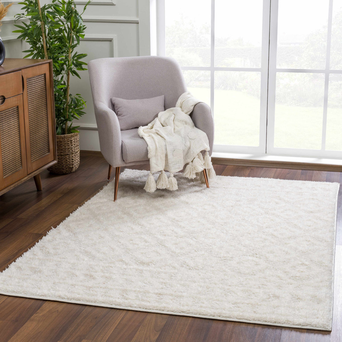 Eivin Cream Diamonds Plush Rug soft cream shag complements a cozy living room chair on Tampa Home & Garden Store