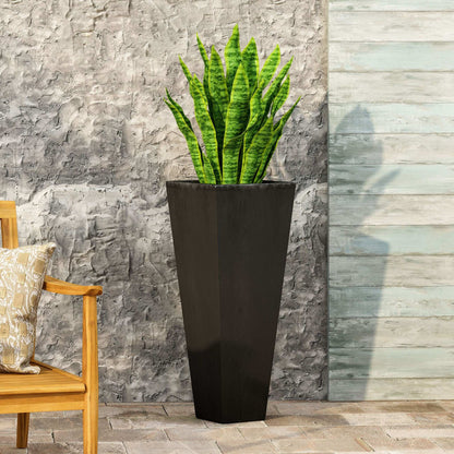 Outdoor Modern Cast Stone Planter tall black planter with green snake plant against wall on Tampa Home & Garden Store