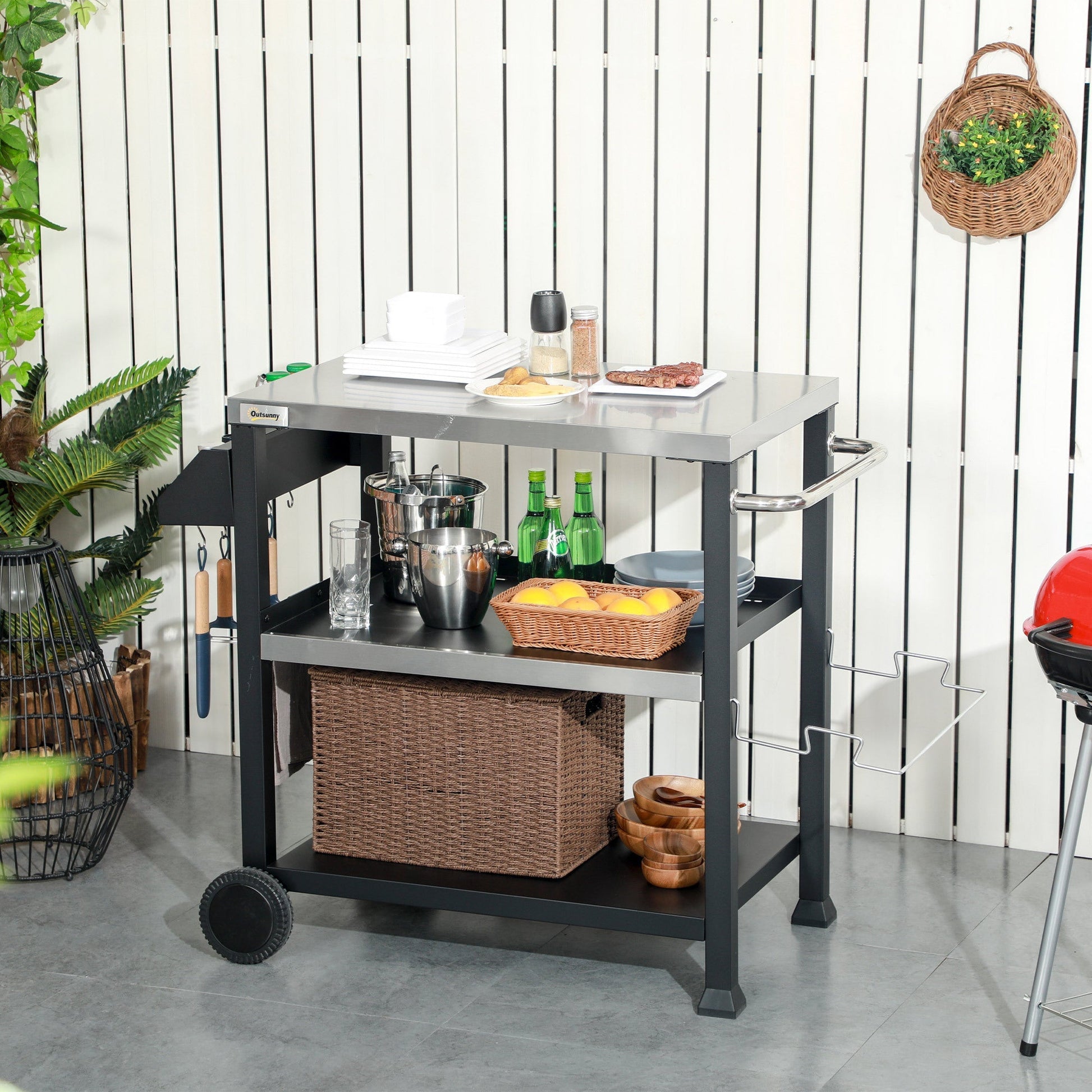 Outsunny three-shelf outdoor grill cart with stainless steel tabletop and wicker lower basket on Tampa Home & Garden Store