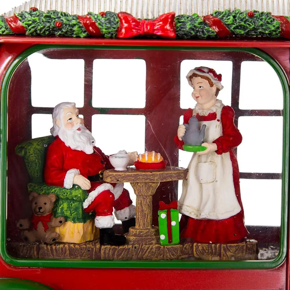 Christmas resin camper scene with two figures Mr. & Mrs. Santa tea time inside a red camper on Tampa Home & Garden Store