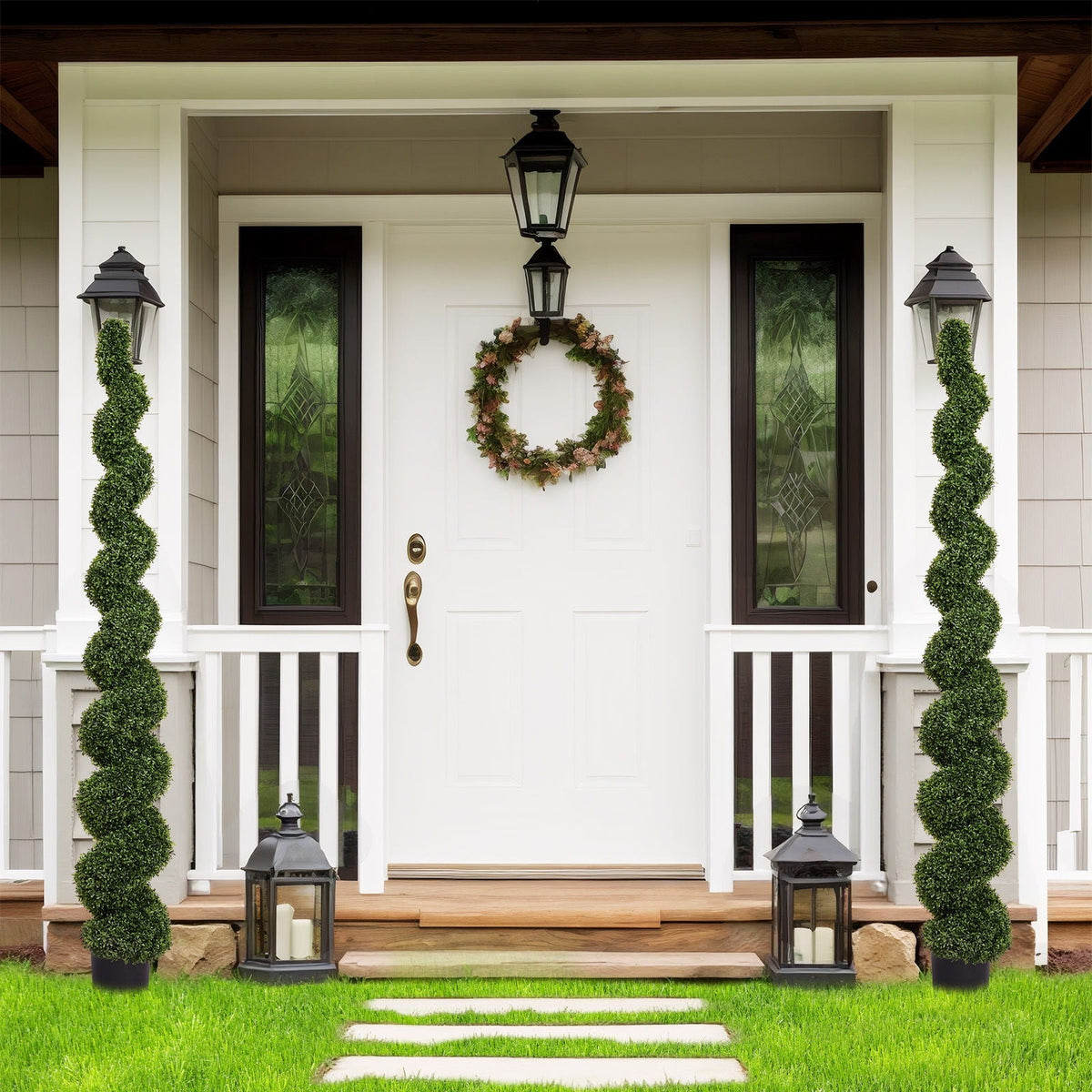 Artificial UV resistant green boxwood topiary spiral tree pair in pots flanking a front door on Tampa Home & Garden Store