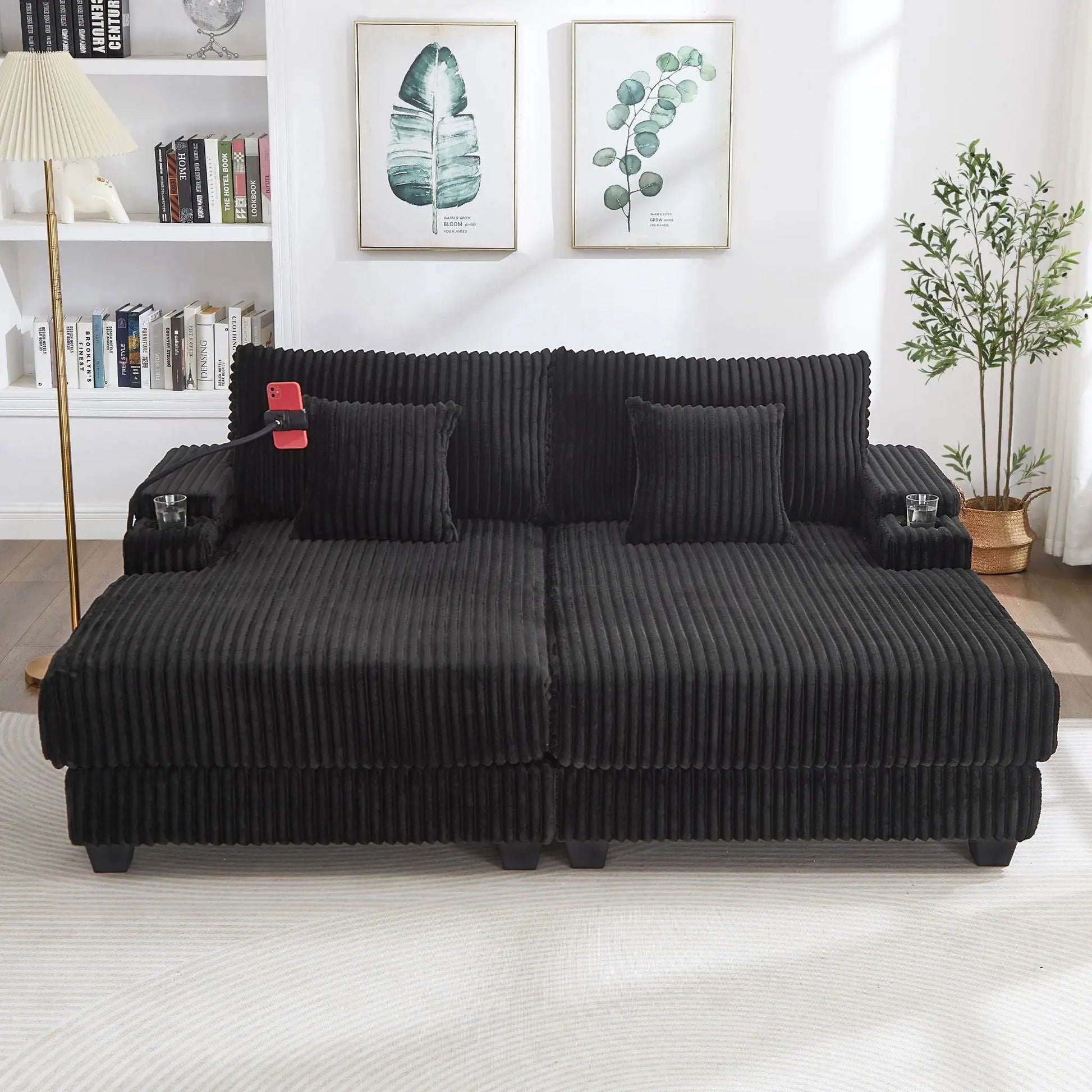 Modern chaise sofa in black ribbed fabric with low legs in a bright living room on Tampa Home & Garden Store