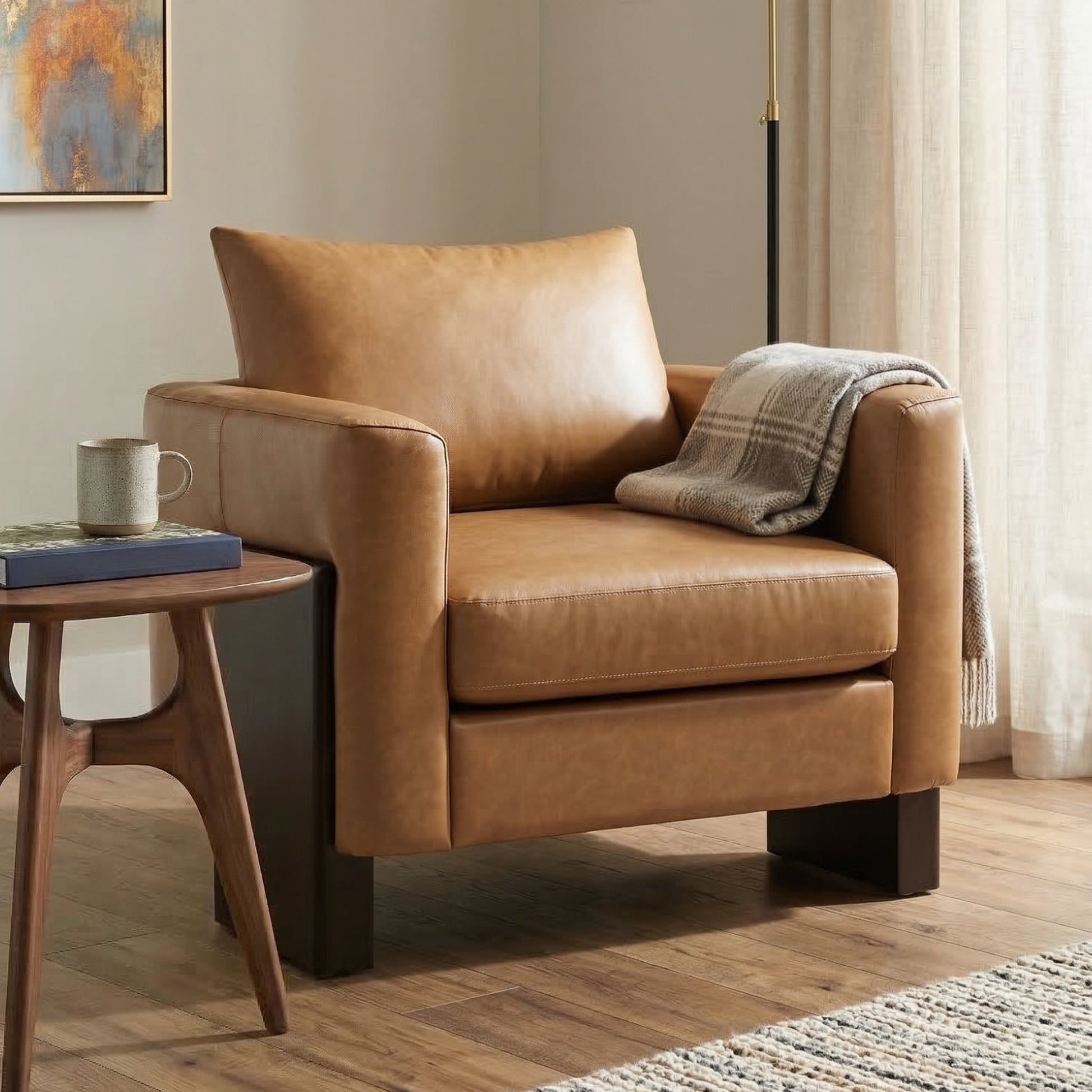 Modern Accent Chair in tan faux leather with rubberwood legs shown with a round wood side table on Tampa Home & Garden Store