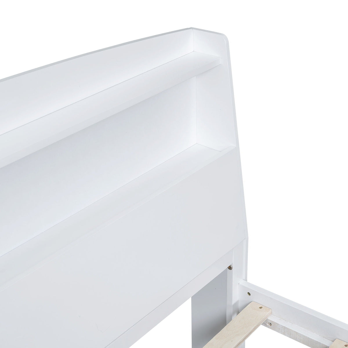 White platform bed frame close-up with exposed trundle rail on Tampa Home & Garden Store