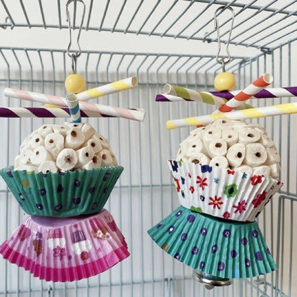 Parrot toy edible soft ball with shredded white pieces, colorful wrappers, two toys on Tampa Home & Garden Store
