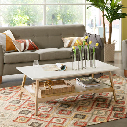 Modern coffee table with storage shelf, white top, wood legs, open lower shelf with baskets on Tampa Home & Garden Store