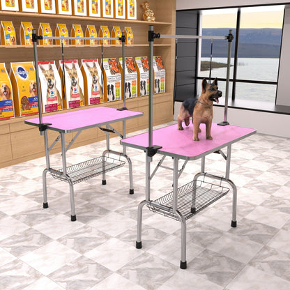 Pair of folding dog grooming tables with stainless steel frames and pink mats; adjustable arms on Tampa Home & Garden Store