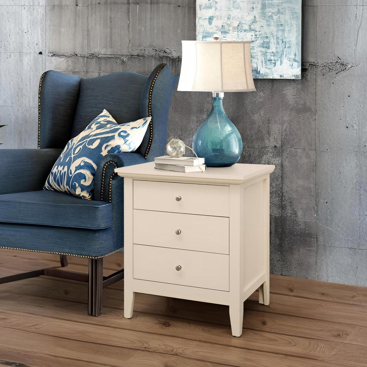3 Drawer Nightstand with dove-tailed drawers in white beside a blue sofa and teal lamp on Tampa Home & Garden Store