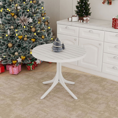 White modern round dining table, waterproof and UV resistant, in a Christmas kitchen on Tampa Home & Garden Store