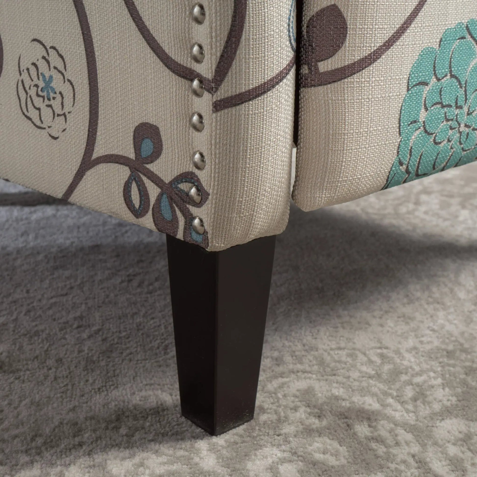 Westeros Wing Back Recliner in beige fabric with brown pattern and nailhead trim, black legs on Tampa Home & Garden Store