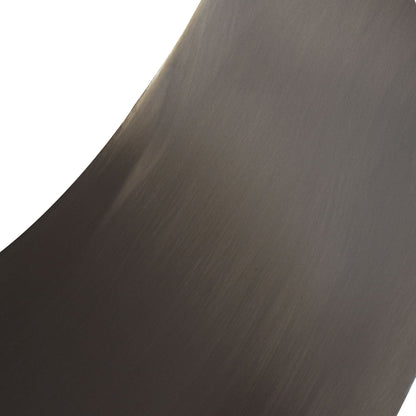 Dining table brushed metal texture close-up with curved edge in dark bronze tone on Tampa Home & Garden Store