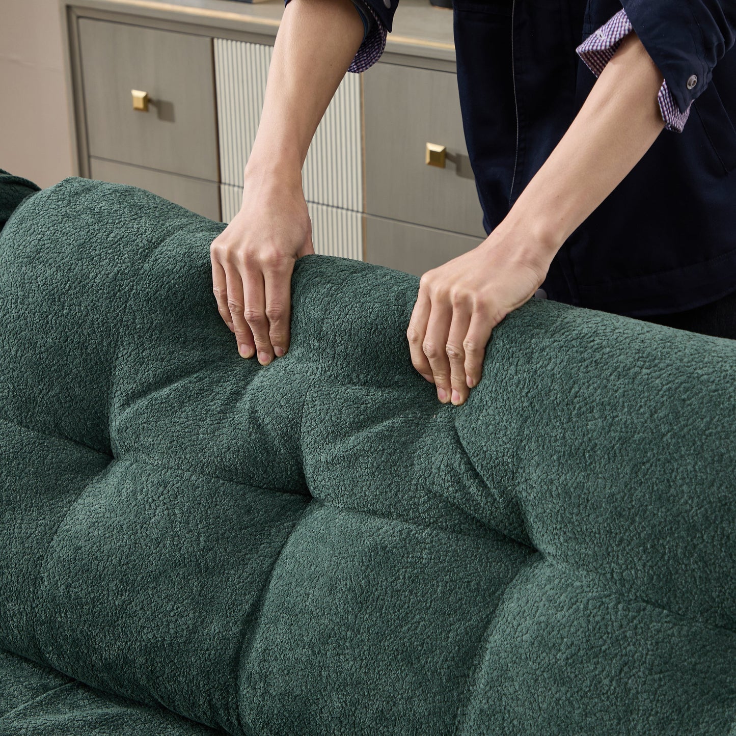 Modular Sectional Sofa Cloud Couch in emerald green textured fabric with hands gripping armrests on Tampa Home & Garden Store