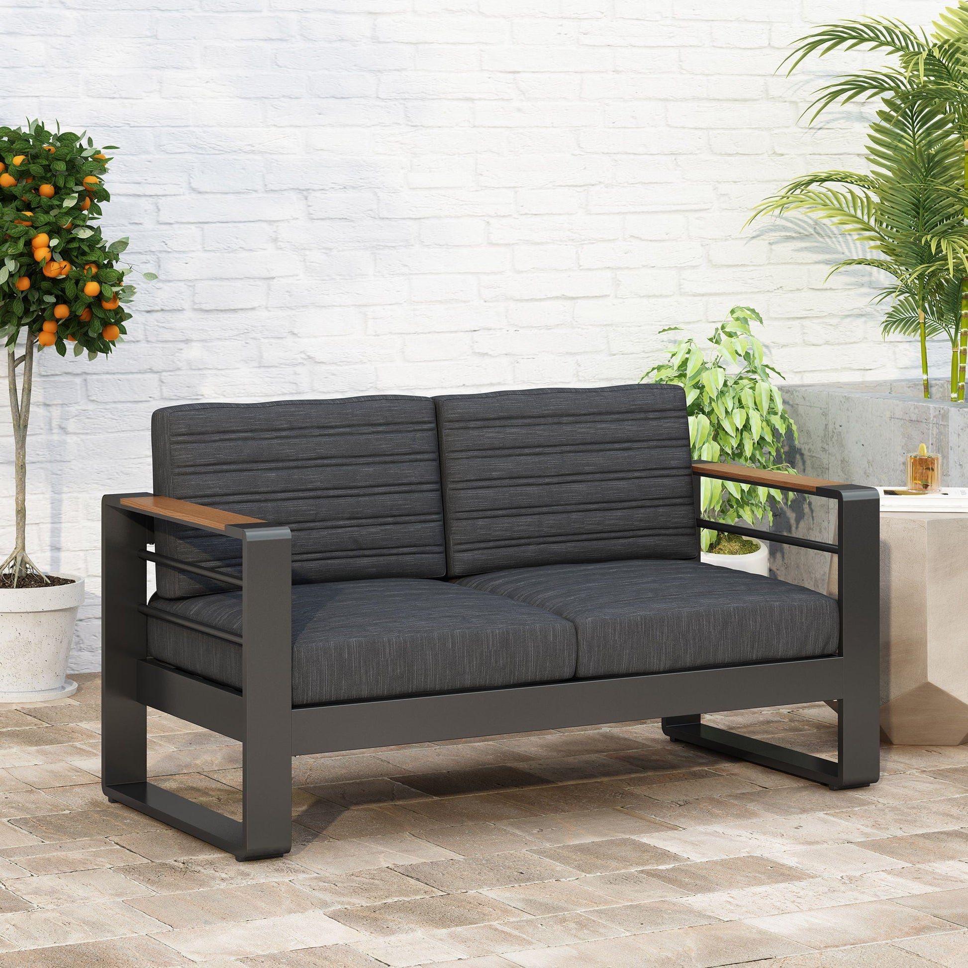 Loveseat With Slat Paneling And Aluminum Frame - Black outdoor sofa with dark cushions on Tampa Home & Garden Store