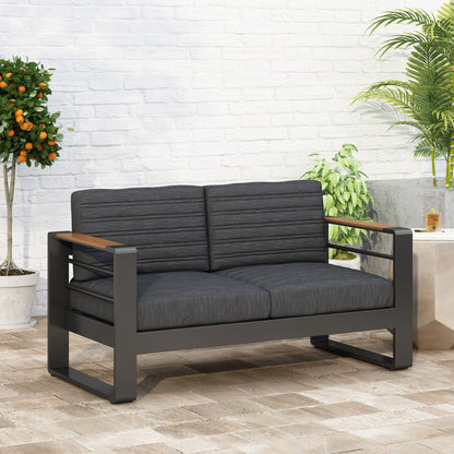 Loveseat With Slat Paneling And Aluminum Frame - Black outdoor sofa with dark cushions on Tampa Home & Garden Store