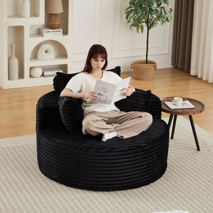 Modern single sofa with backrest pillow in black rope-textured fabric, person reading a magazine, HouseOfZazla on Tampa Home & Garden Store
