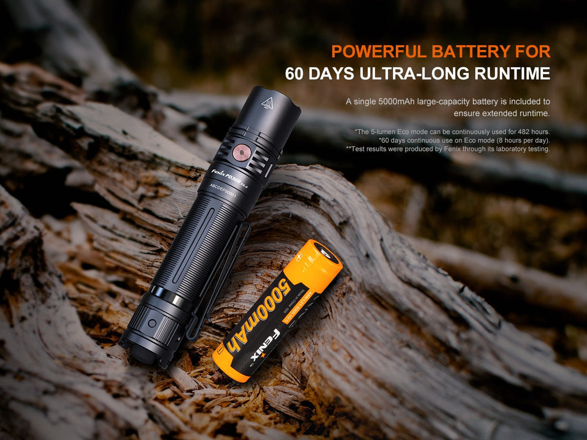Fenix PD36R V2 tactical flashlight black with orange 5000mAh battery on rugged log on Tampa Home & Garden Store