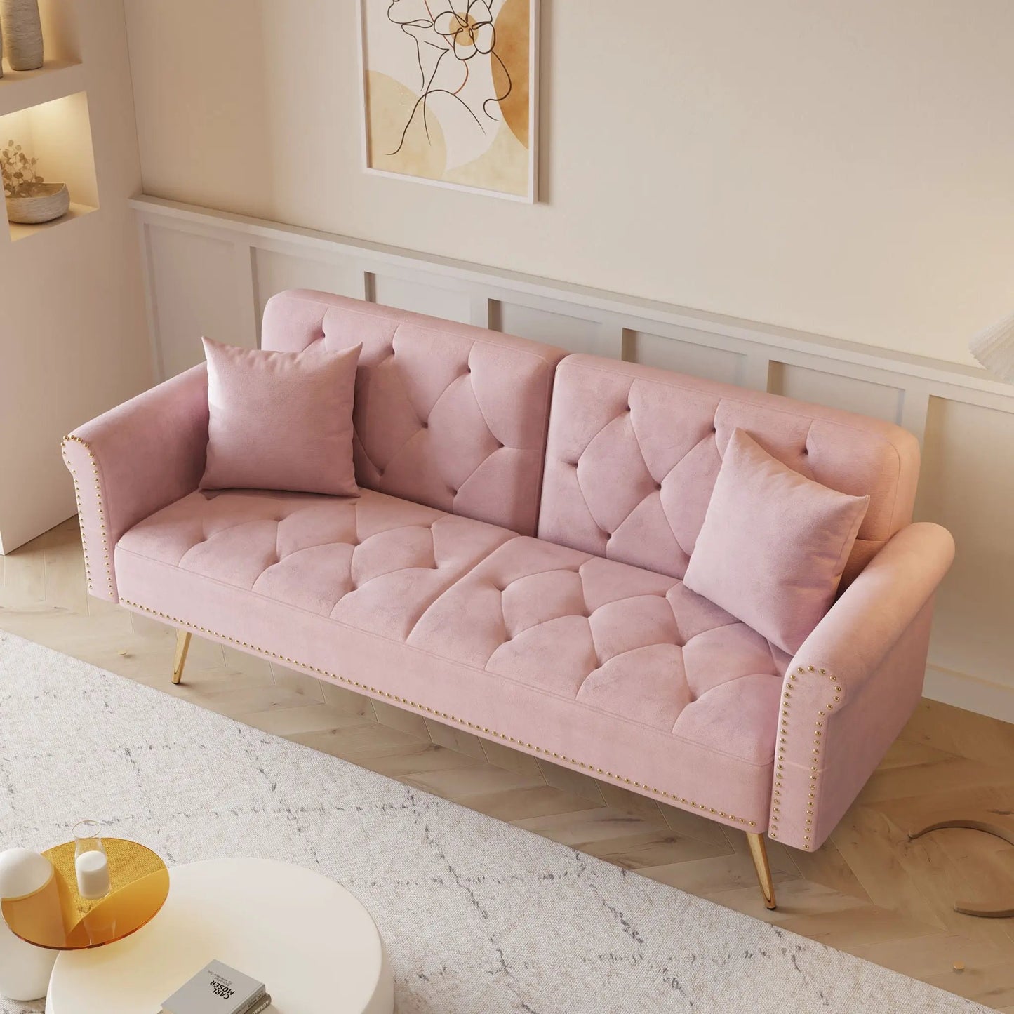 Luxurious pink velvet futon sofa bed with nail head trim and matching pillows on Tampa Home & Garden Store