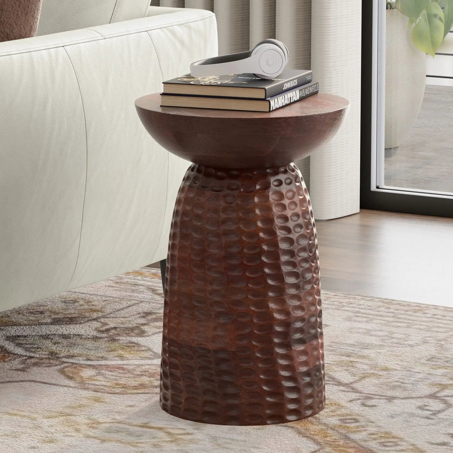 Boyd Handcrafted Accent Table copper hammered finish with 3 books and white headphones on Tampa Home & Garden Store