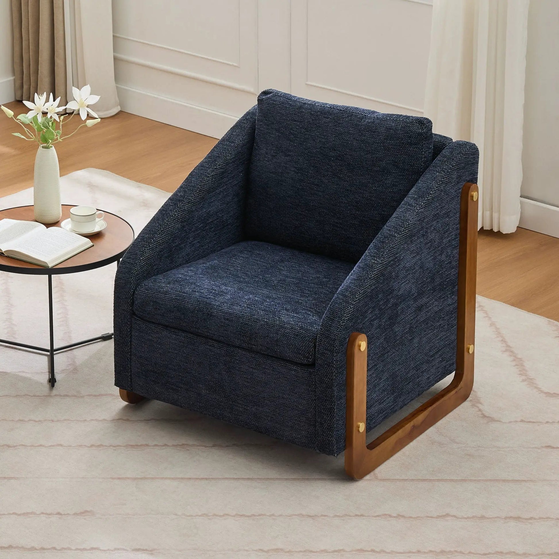 Modern upholstered armchair with navy blue textured fabric and wooden side frame on Tampa Home & Garden Store