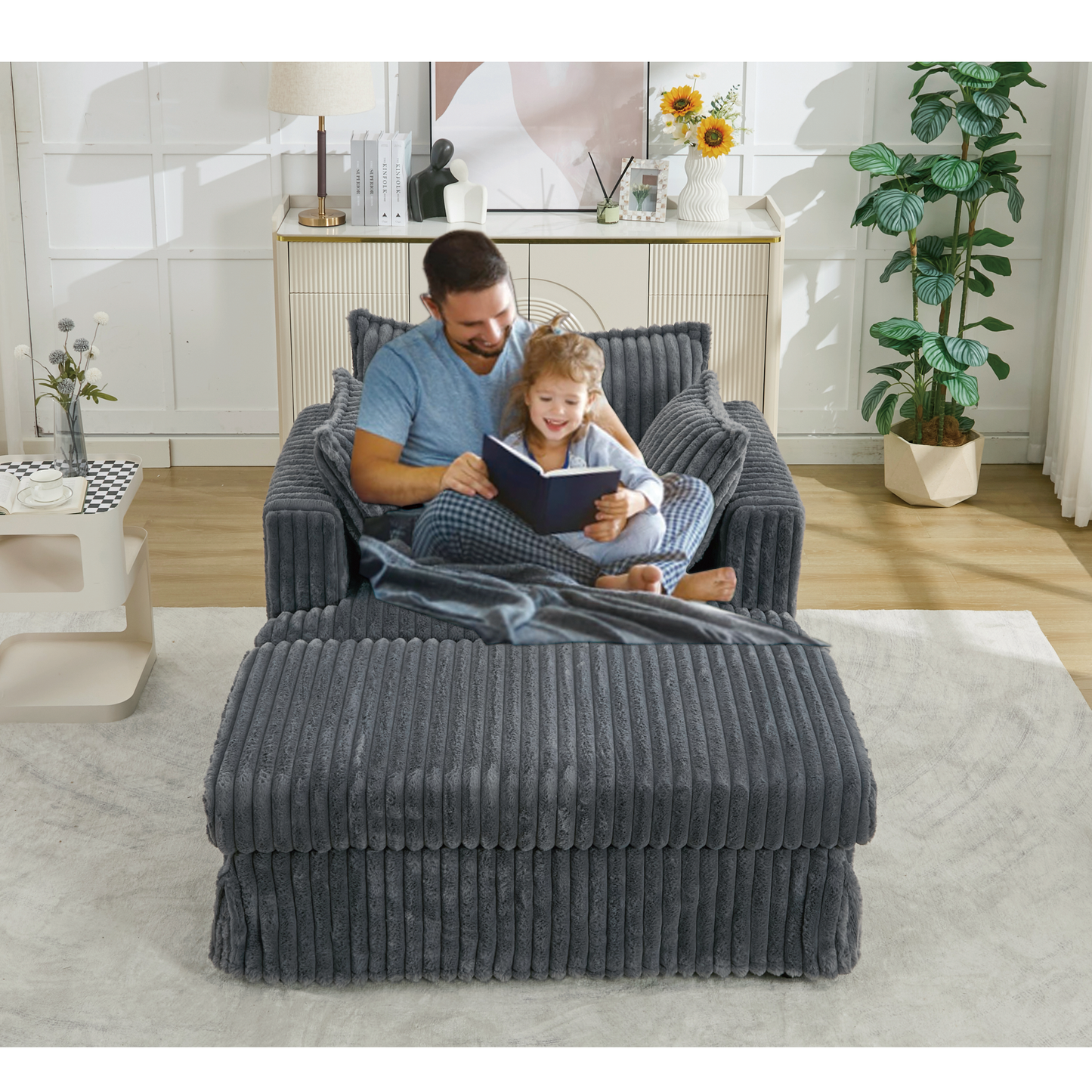 Oversized Corduroy Chaise Lounge with Ottoman in Dark Gray with two people reading on Tampa Home & Garden Store