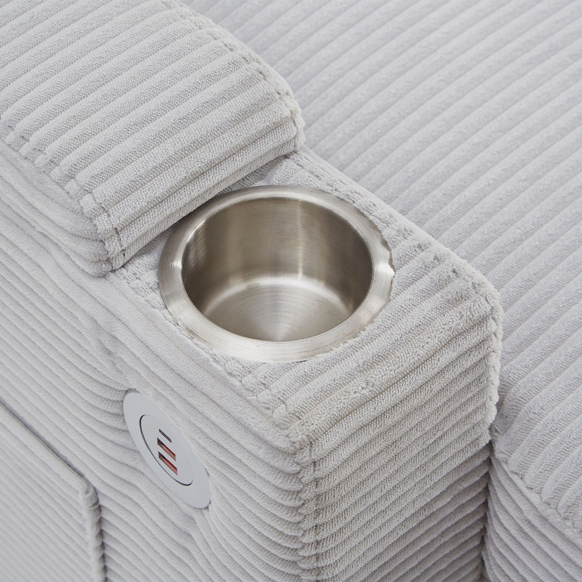 Gray striped sleeper ottoman fabric close-up with a stainless steel bowl on top on Tampa Home & Garden Store
