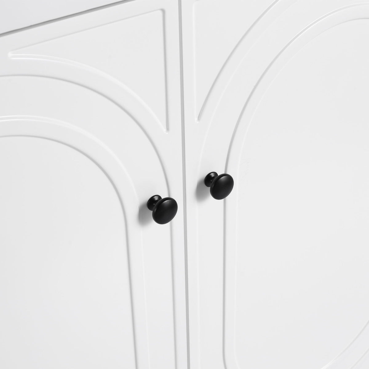 Freestanding bathroom vanity with soft close, white paneled doors and black round knobs on Tampa Home & Garden Store