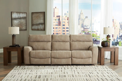 Next-Gen Durapella reclining sectional beige fabric with wood end tables in a city living room on Tampa Home & Garden Store