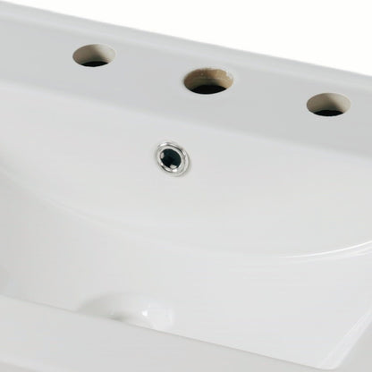 Vanities white bath surface with three circular holes along edge and chrome drain on Tampa Home & Garden Store