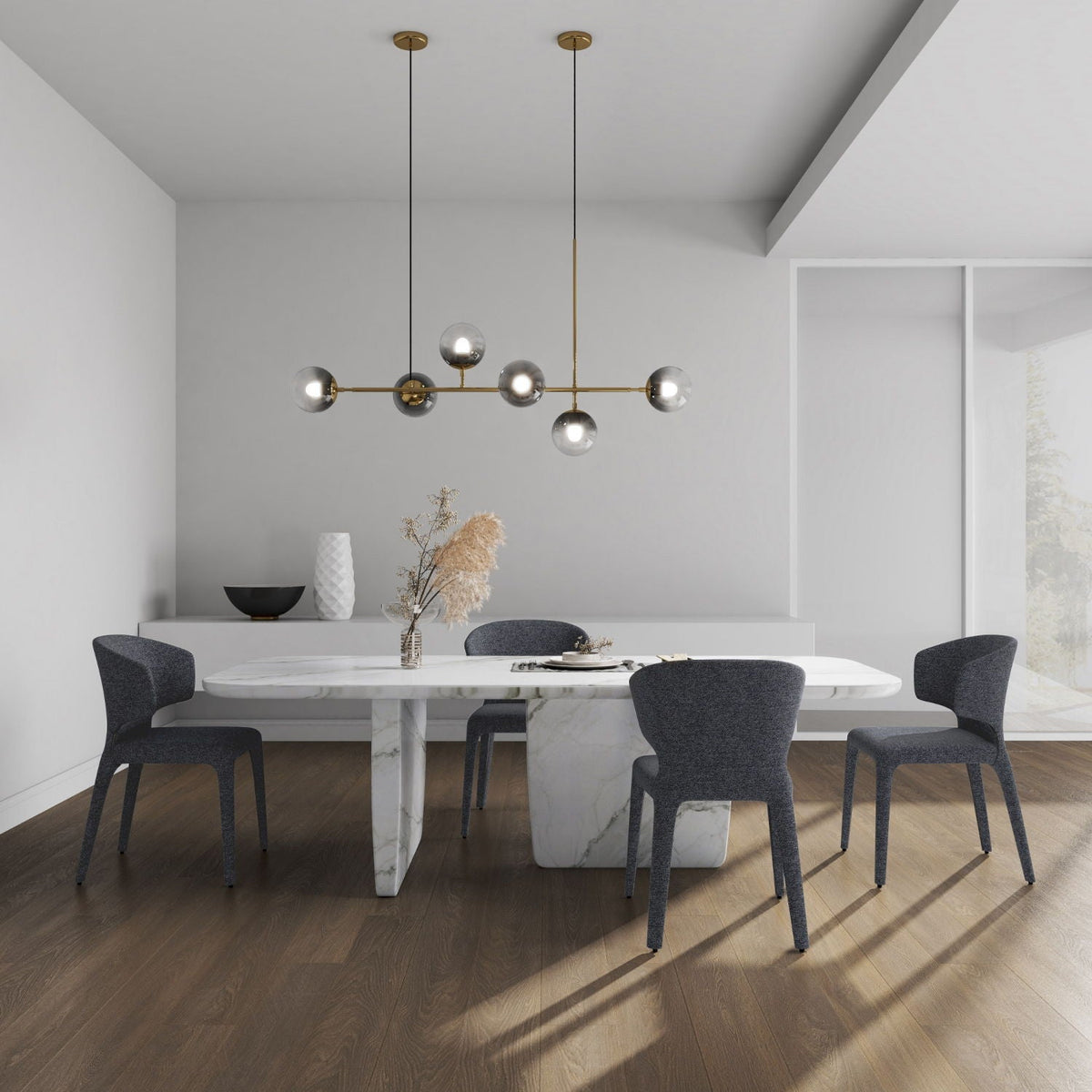 Conrad dining chairs with metal frames, four gray upholstered seats around a marble table on Tampa Home & Garden Store