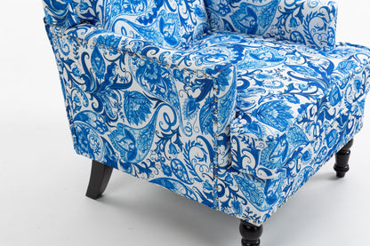 Upholstered accent chair in blue white porcelain print linen with nailhead trim and dark legs on Tampa Home & Garden Store