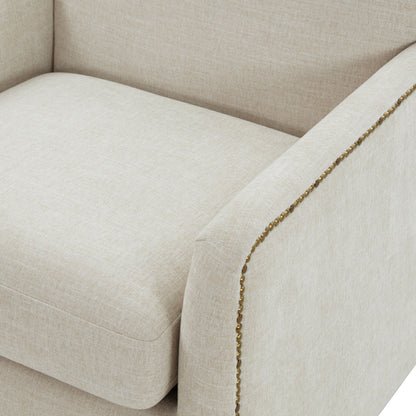 Swivel accent chair beige upholstery with antique brass nailhead trim along edge on Tampa Home & Garden Store