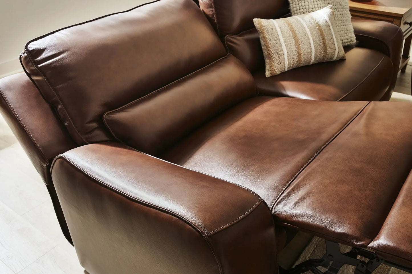 DeepWakes 2-Seat Power Reclining Sofa in brown leather with stitched seams on Tampa Home & Garden Store